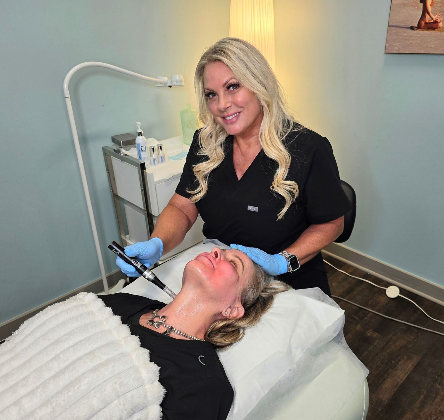 Woman receiving a skincare treatment in spa.