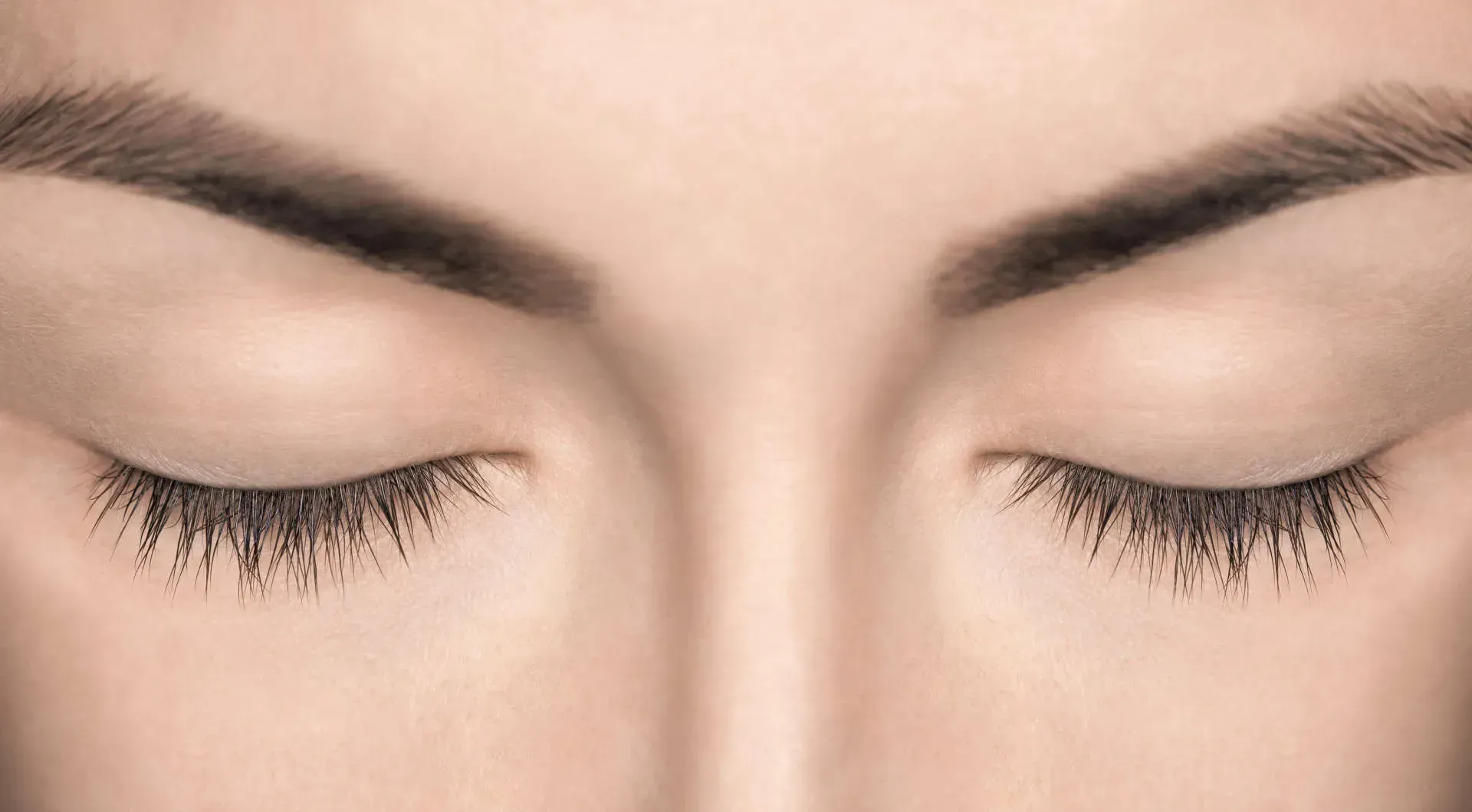 Close-up of closed eyes and eyelashes.